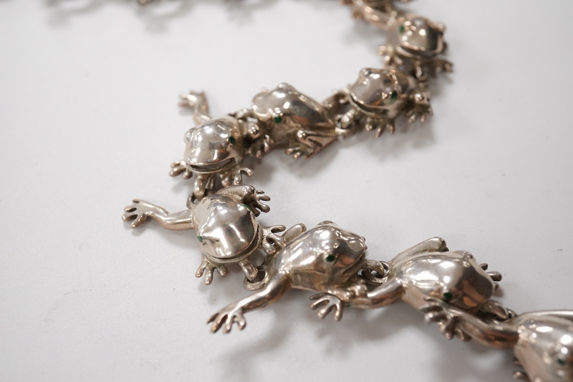 A recent white metal frog necklace, overall length 42cm and matching bracelet, 19cm, both stamped 925, gross 153 grams.